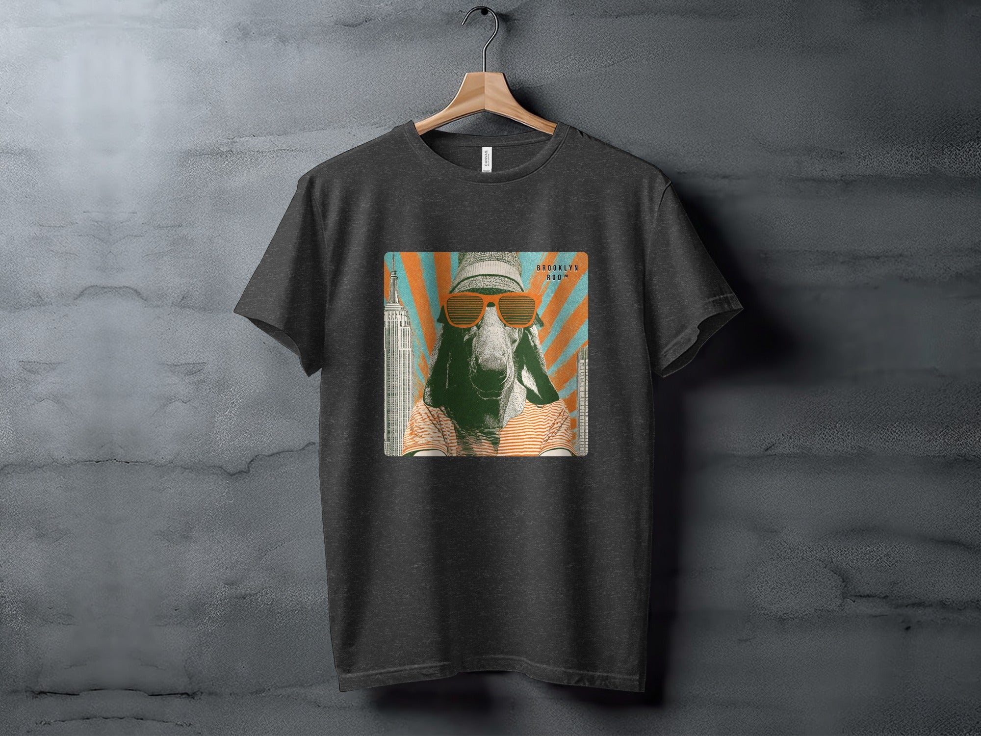 T-shirt with graphic of a goat wearing sunglasses and a hat.