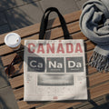 Tote bag with "CANADA" and periodic table elements Ca, Na, Da over map of Canada.