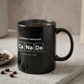 Black mug with periodic table elements spelling "Ca Na Da" and "HOME SOIL. 2026".