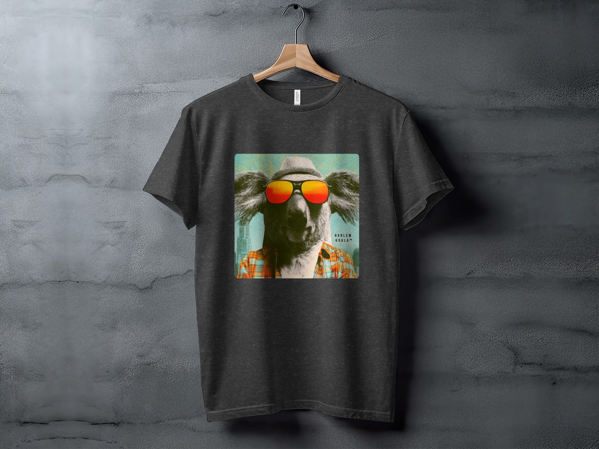 Dark t-shirt with graphic of a koala wearing sunglasses and a hat.